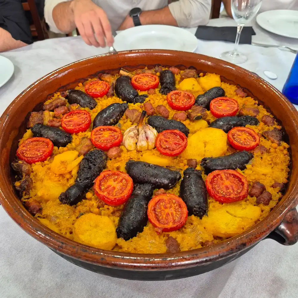 Arroz al horno con morcilla, tomate y patata en Restaurante Hermanos Navarro